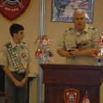 North Naples Fire Chief presenting Eagle statue to David Rose, Troop #2001, 05.22.2016