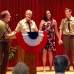 Mr. Rassner giving the Eagle Charge to Ryan with his Father & Scout Master Randy & Mother Carolyn looking on.